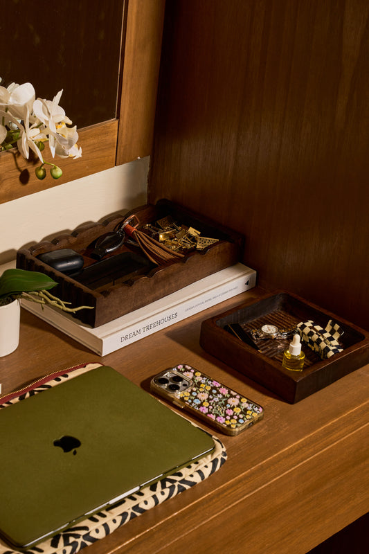 A layout of handmade wooden trays used on a desk as organisers