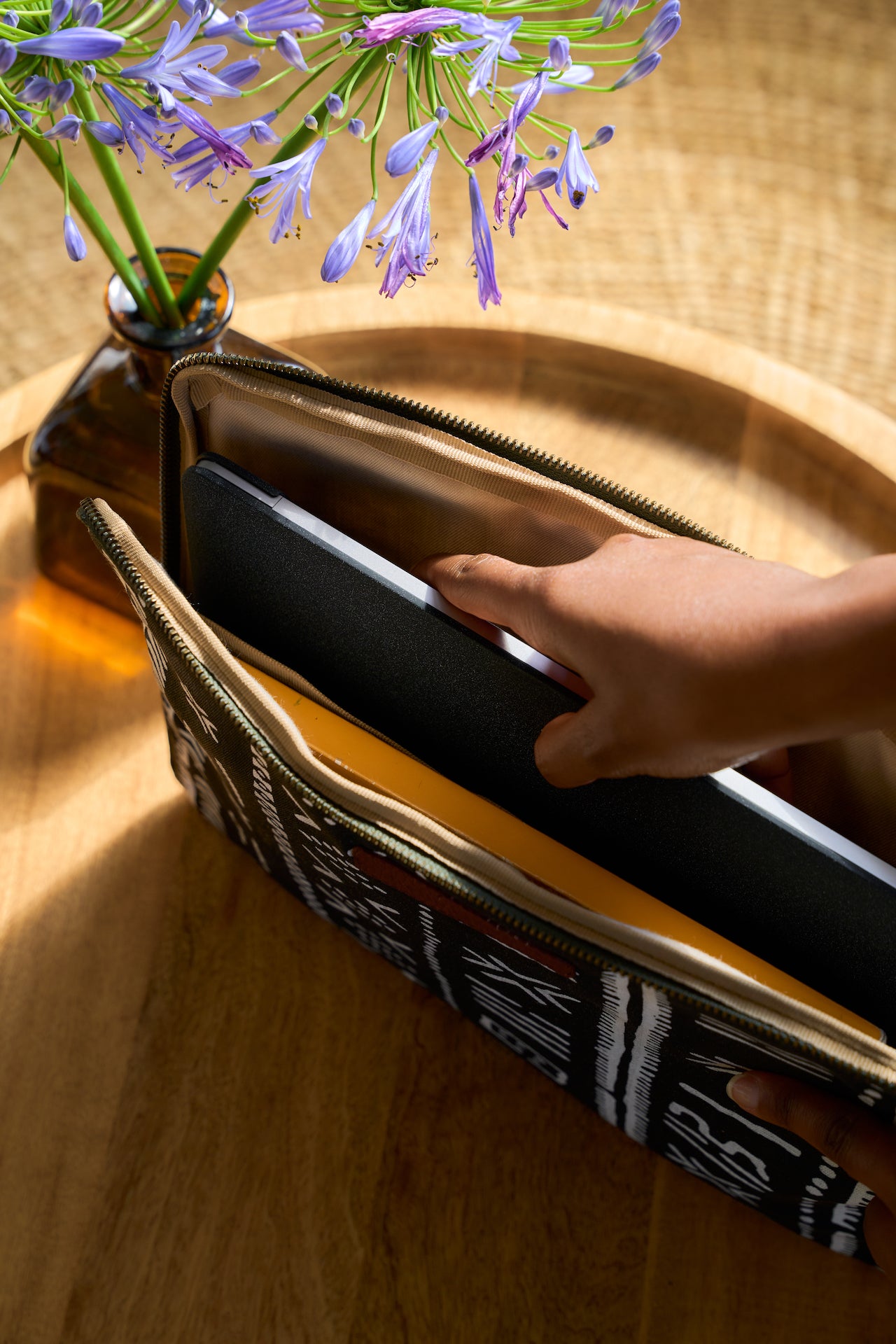 Laptop sleeve with laptop partially inserted