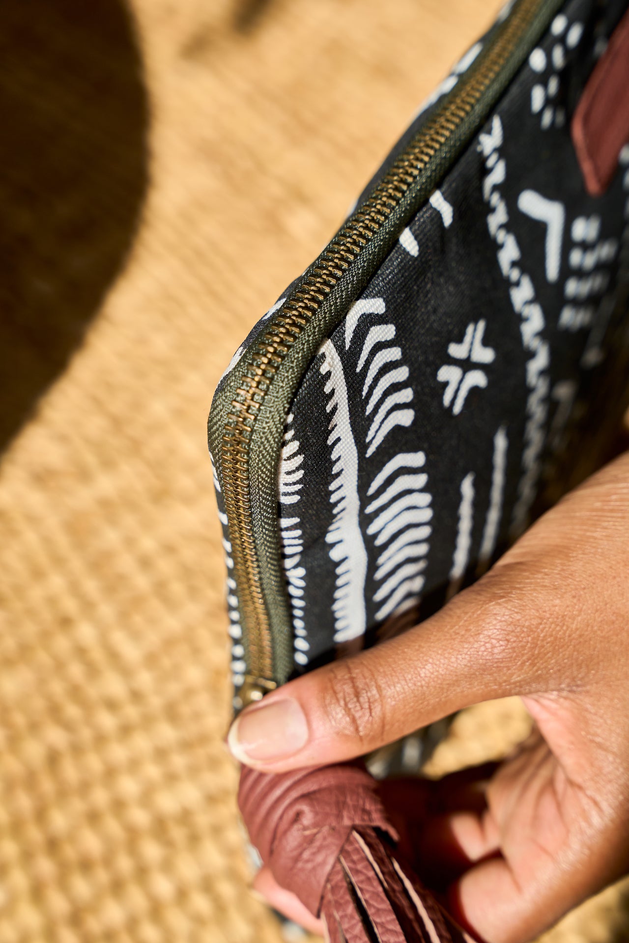 Laptop sleeve leather zipper pull detail