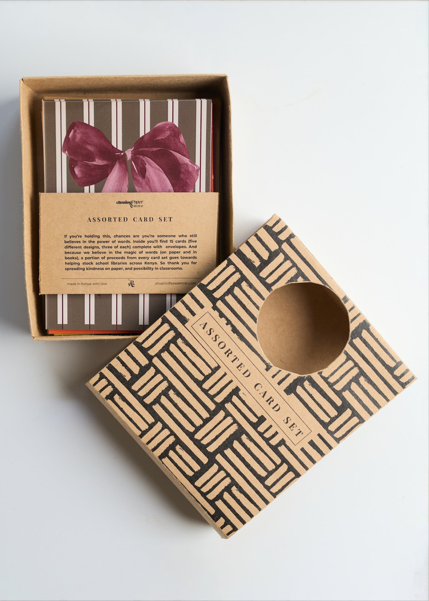 Assorted greeting card pack with "In banana years, you're bread" HBD card, retro cassette tape, and large pink bow design on a white background.