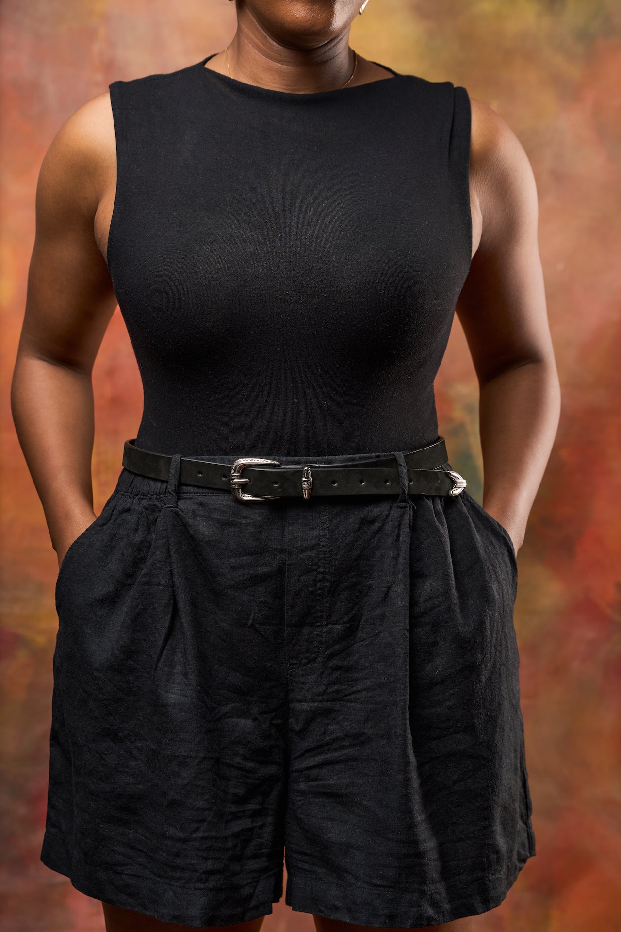 Black Cairo suede belt worn at waist