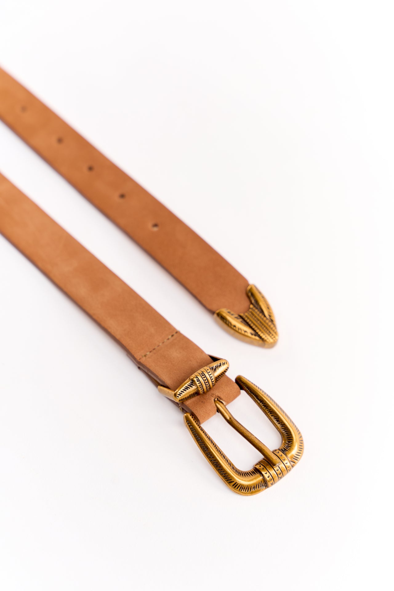 tan suede leather belt with brass buckle for women crafted in Nairobi kenya in a white background.