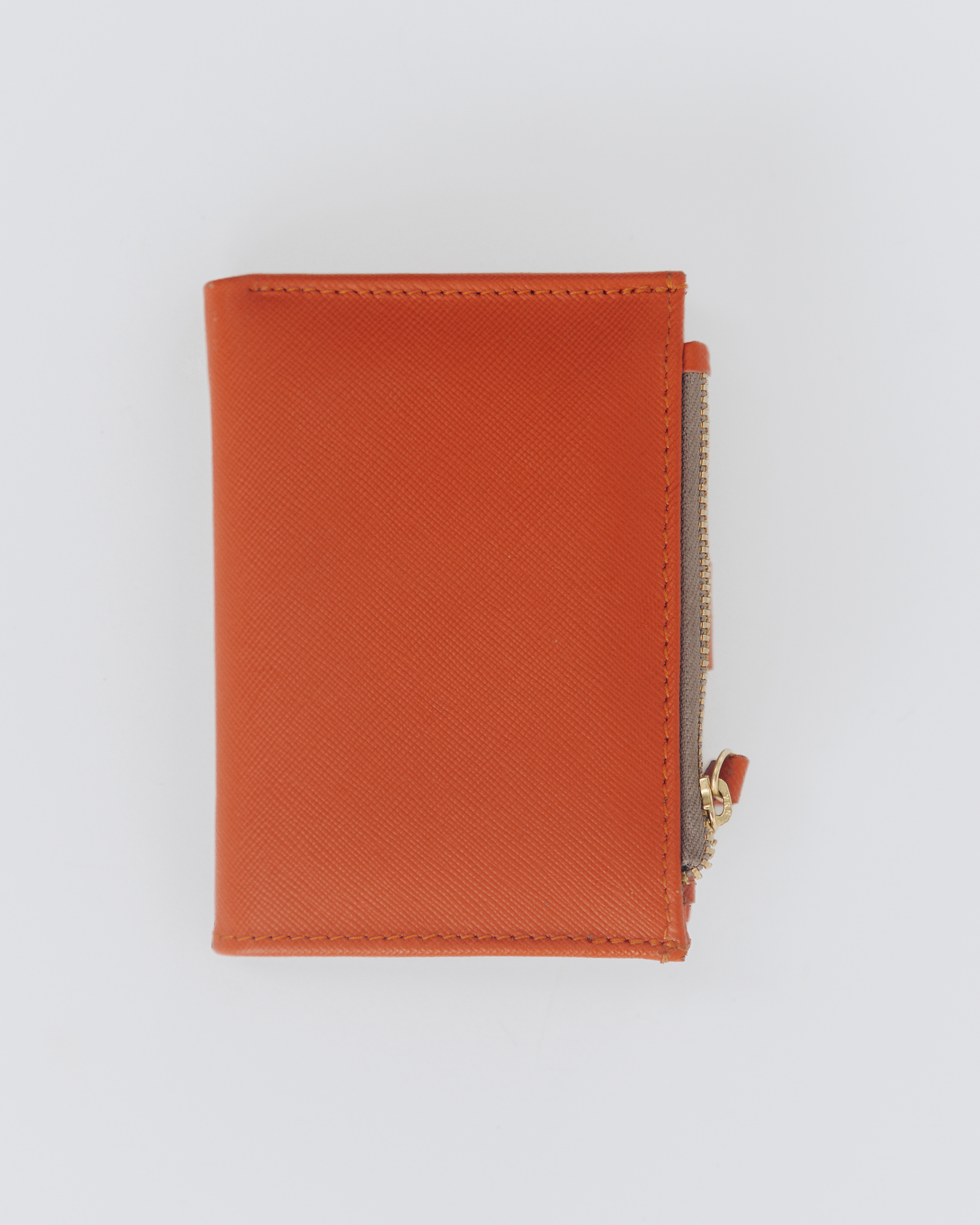 Back view of orange bifold wallet