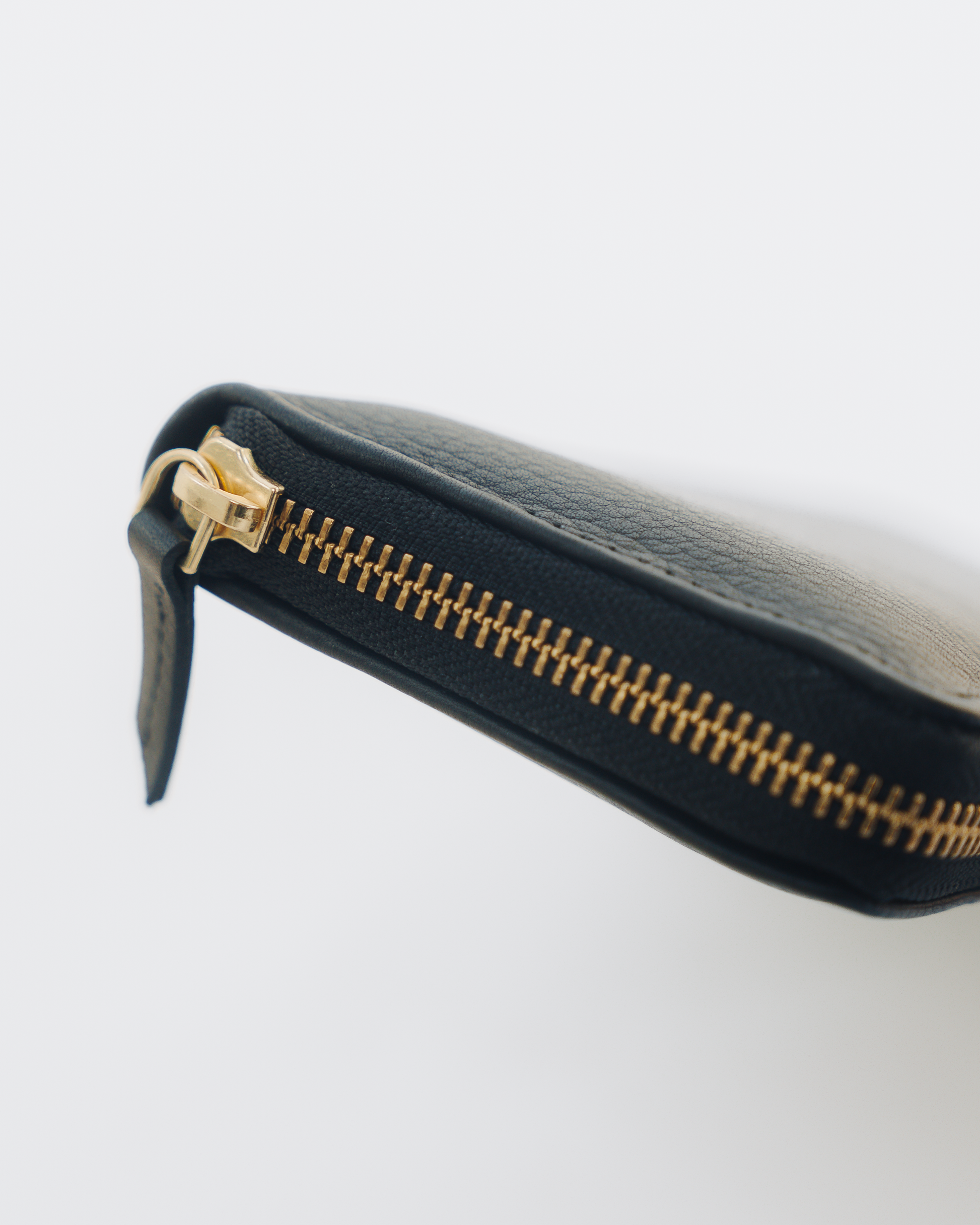 Essential Black leather wallet Gold zipper and zipper pull detail 