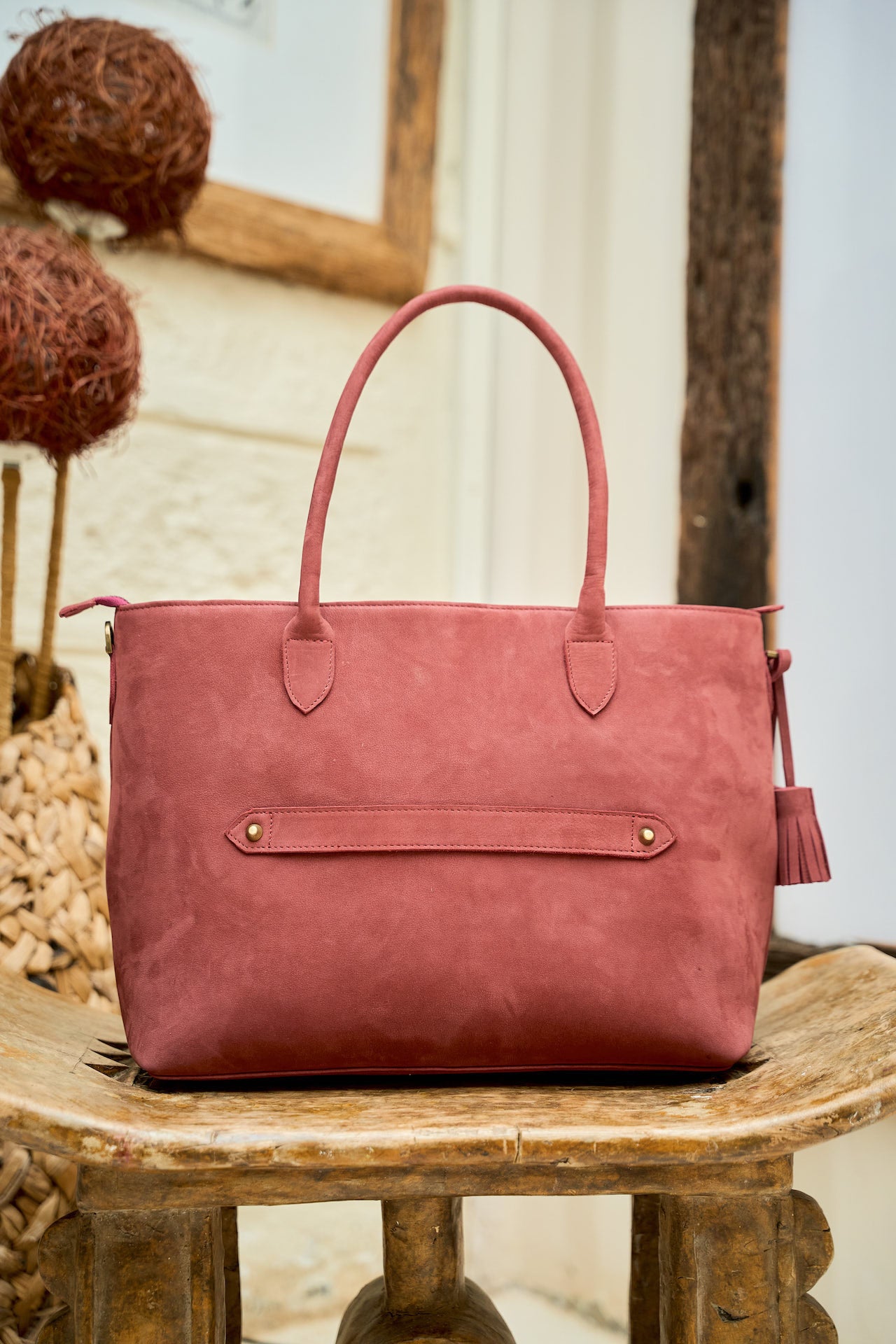 Everyday Suede Tote suitcase pass-through detail.
