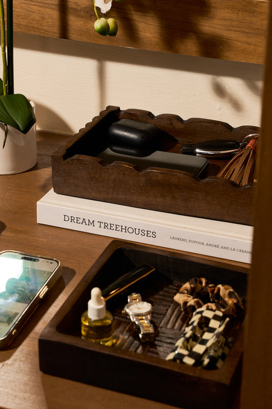 Wooden tray with grooming items on a wooden table 