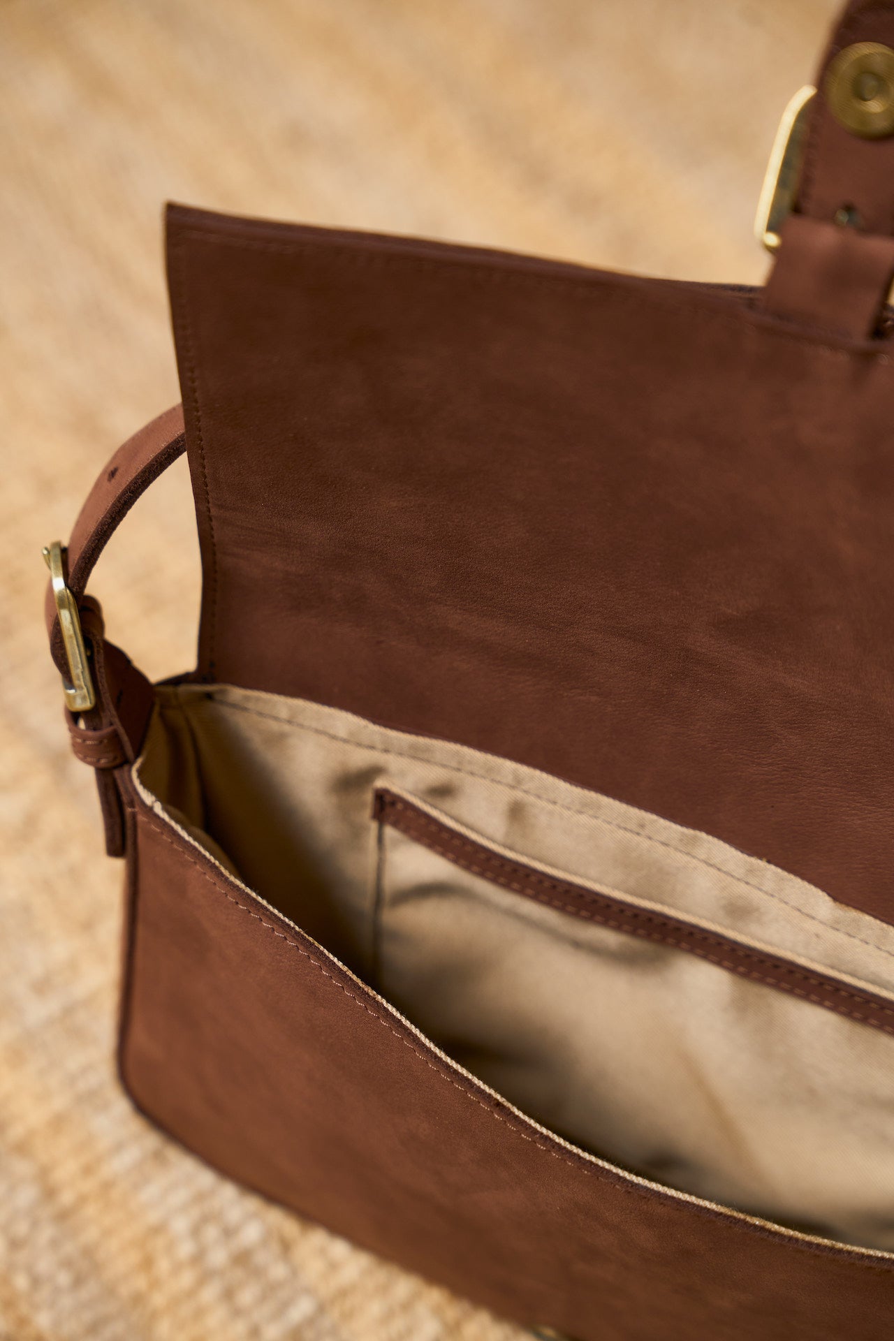 Brown suede leather bag with gold buckle interior 