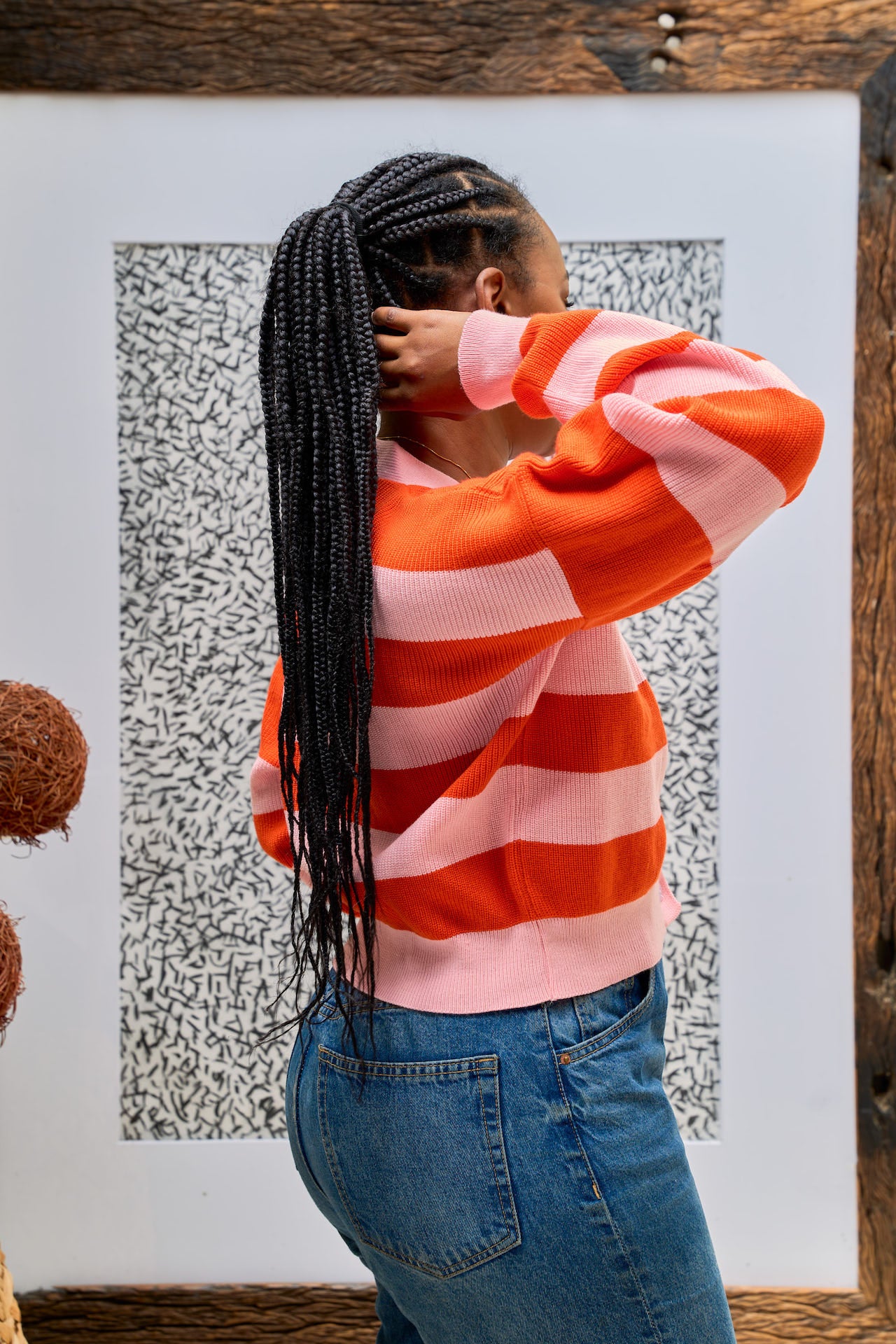 Pink and tangerine knit cropped cardigan side view