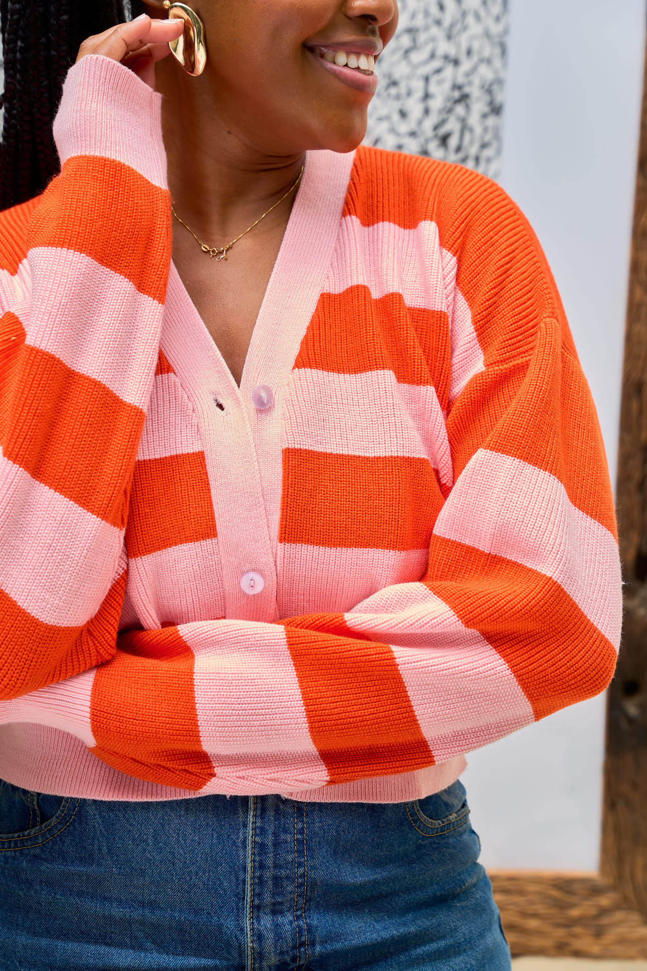 Pink and orange cropped cardigan front view