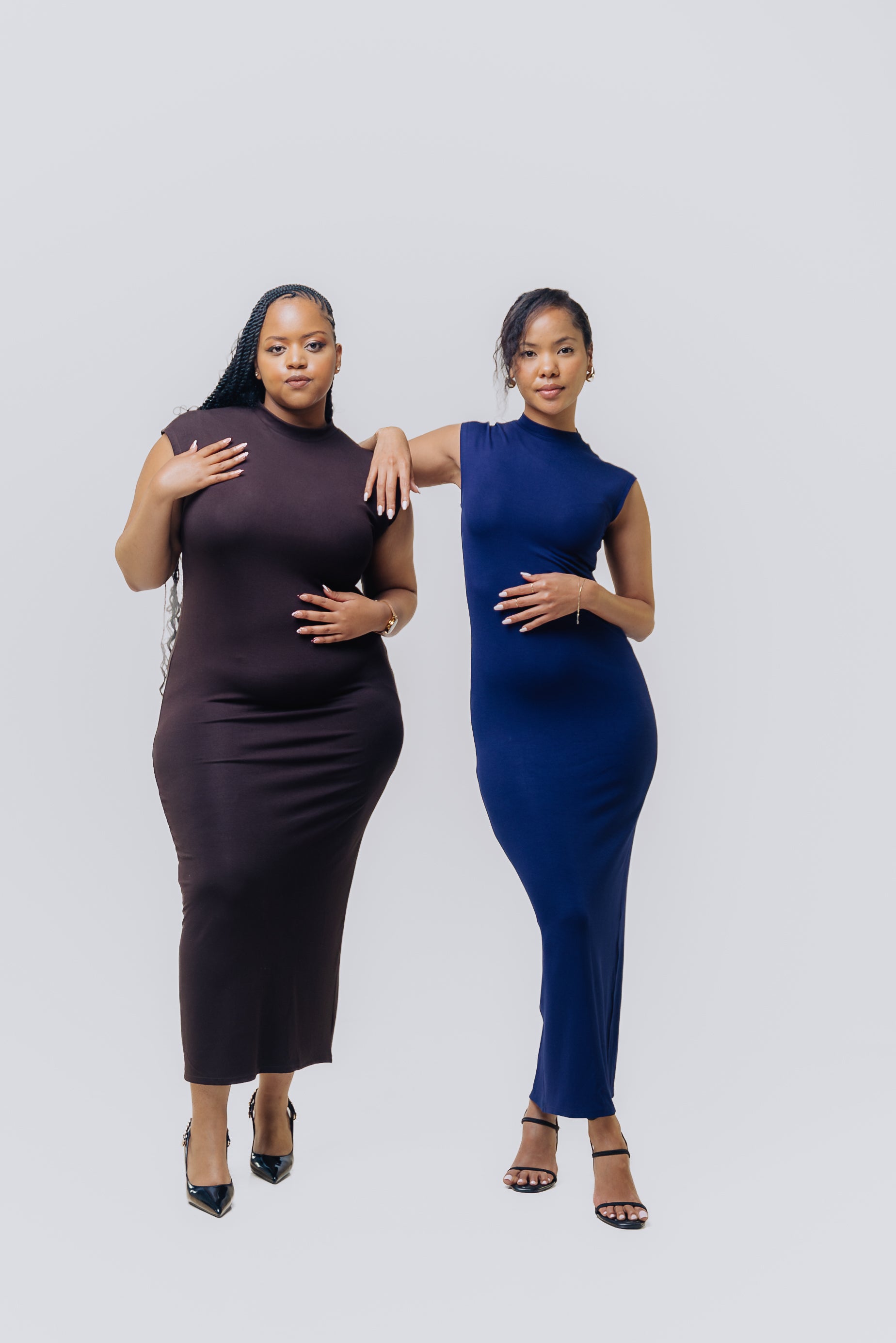 Models wearing Navy and Chocolate essential midi dress in a studio