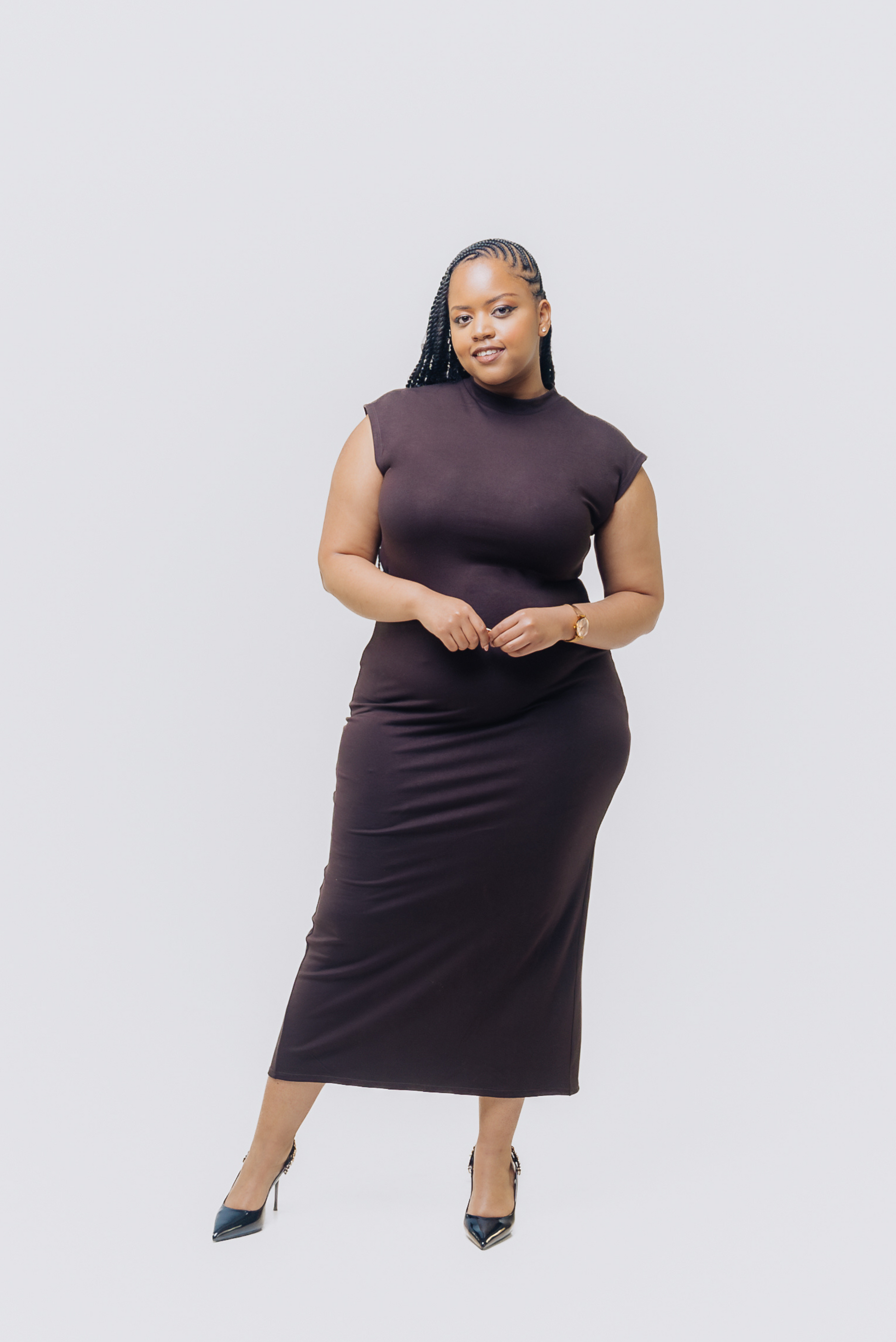 Chocolate midi bodycon dress worn by plus size model