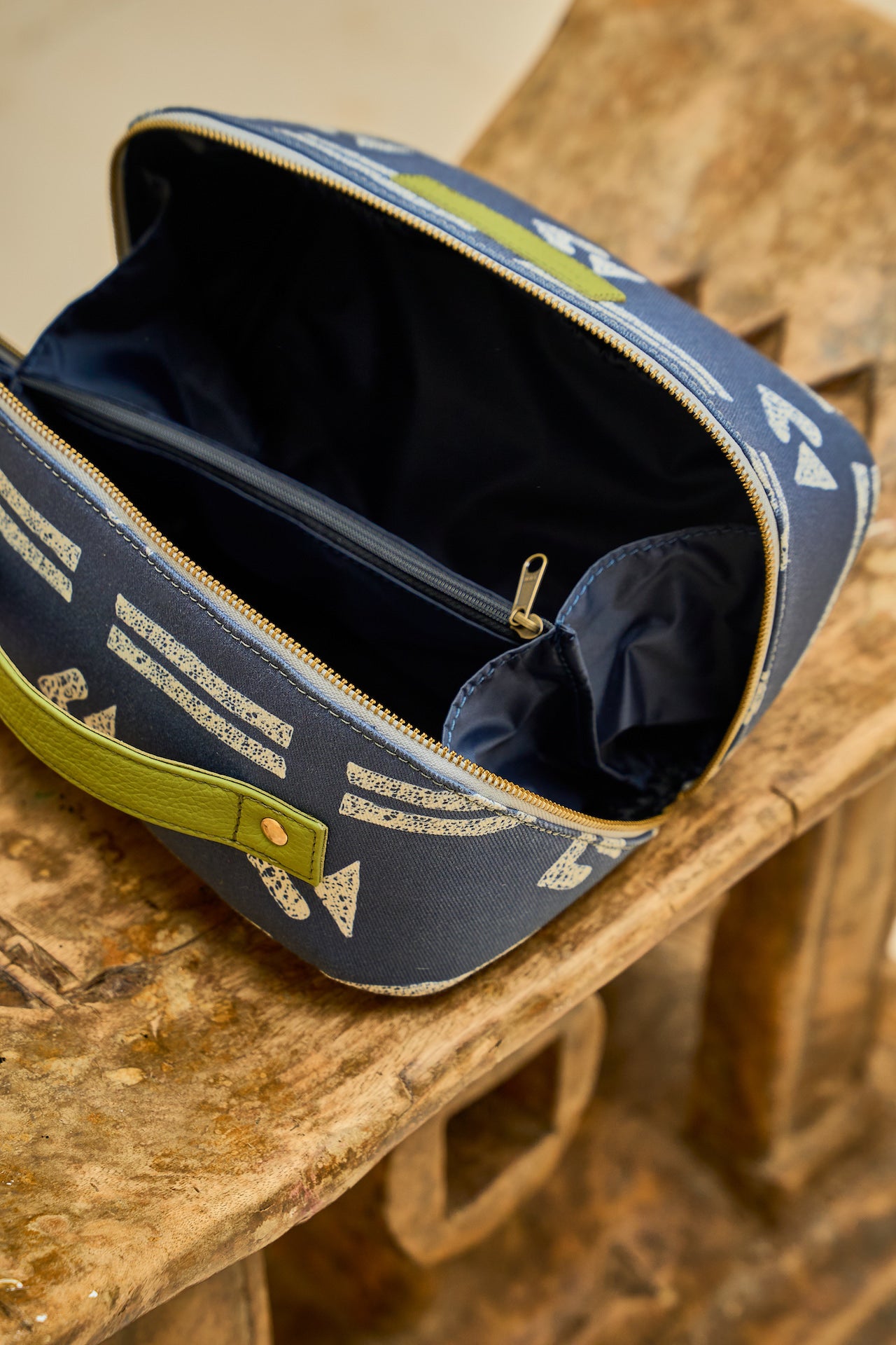  Blue Zola toiletry bag interior showing compartments with zipped pocket